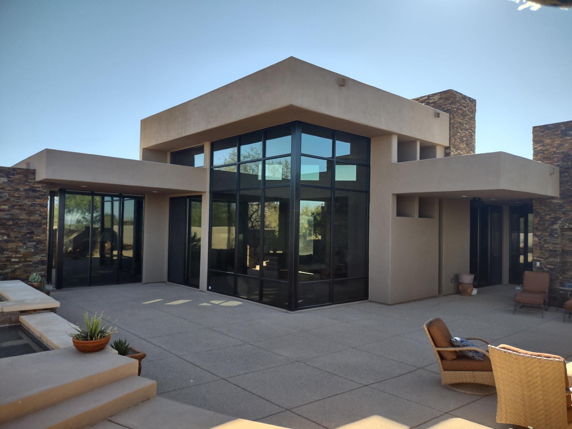 Clear window film reducing heat while preserving the outdoor view